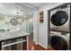 Convenient laundry area adjacent to the kitchen, featuring modern washer and dryer units at 64 Montre Nw Sq, Atlanta, GA 30327
