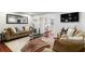 Inviting living room with hardwood floors, comfortable seating, large mirror, and stylish decor at 64 Montre Nw Sq, Atlanta, GA 30327
