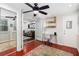 Home office with hardwood floors, natural light, a modern desk, and a view into the living room at 64 Montre Nw Sq, Atlanta, GA 30327