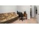 Carpeted bedroom with a sofa and a desk; a doorway leads to the view of a bathroom at 79 Mountain View Ct, Dallas, GA 30157