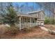 Charming home with a welcoming covered porch and lush landscaping at 79 Mountain View Ct, Dallas, GA 30157