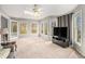 Spacious living room has multiple windows for plenty of light, and features access to the outdoors at 79 Mountain View Ct, Dallas, GA 30157