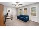 Comfortable living room with a ceiling fan, desk, and large windows at 79 Mountain View Ct, Dallas, GA 30157