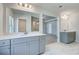 Elegant bathroom featuring double vanity, large mirror, and sleek marble flooring at 200 Haverling Pass, Hampton, GA 30228