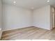 A cozy bedroom featuring plank flooring, neutral walls and recessed lighting at 200 Haverling Pass, Hampton, GA 30228