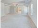 Bedroom with attached bathroom, trey ceiling, and neutral colored carpet at 200 Haverling Pass, Hampton, GA 30228