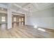 Elegant dining room with hardwood floors, coffered ceiling, chandelier, and wainscoting at 200 Haverling Pass, Hampton, GA 30228