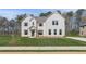 Charming two-story home with brick facade, gabled roof, and green lawn at 200 Haverling Pass, Hampton, GA 30228