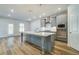 Well-appointed kitchen featuring center island, stainless steel appliances, and plenty of counter space at 200 Haverling Pass, Hampton, GA 30228