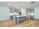 Stylish kitchen boasts a spacious island, stainless steel appliances, and shaker cabinets at 200 Haverling Pass, Hampton, GA 30228