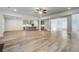 Expansive living area showcases hardwood floors, open-concept design, and seamless flow between spaces at 200 Haverling Pass, Hampton, GA 30228