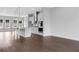 Open concept kitchen with a center island, modern appliances, and wood floors at 587 Red Clay Farm Ln, Suwanee, GA 30024