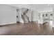 Modern open-concept living room with wood floors and lots of natural light at 587 Red Clay Farm Ln, Suwanee, GA 30024