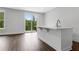 Open-concept living area with hardwood floors and access to a patio at 587 Red Clay Farm Ln, Suwanee, GA 30024