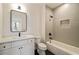 Modern bathroom featuring a tiled shower and a vanity with a framed mirror at 906 Fairfield Dr, Marietta, GA 30068