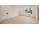 Bright bedroom featuring a large window and light hardwood floors at 906 Fairfield Dr, Marietta, GA 30068