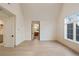 Open bedroom leading to a bathroom. The bedroom has hardwood floors and a large window overlooking the backyard at 906 Fairfield Dr, Marietta, GA 30068