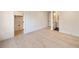 Bedroom featuring light hardwood floors and views to a closet and bathroom at 906 Fairfield Dr, Marietta, GA 30068