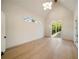 Vaulted bedroom with abundant natural light, light wood flooring, and private backyard at 906 Fairfield Dr, Marietta, GA 30068