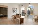 Bright dining room with light wood floors, modern decor, and backyard views through large windows at 906 Fairfield Dr, Marietta, GA 30068