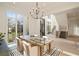 Bright dining room with hardwood floors, large windows, and modern chandelier at 906 Fairfield Dr, Marietta, GA 30068