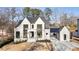 Beautiful new construction with white painted brick and black trim, plus covered three car garage at 906 Fairfield Dr, Marietta, GA 30068
