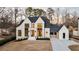 Beautiful new construction with white painted brick and black trim, plus covered three car garage at 906 Fairfield Dr, Marietta, GA 30068