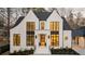 Charming exterior with white painted brick, black trim, and great curb appeal at 906 Fairfield Dr, Marietta, GA 30068