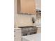 Close-up of a modern kitchen featuring stainless steel gas range and custom range hood at 906 Fairfield Dr, Marietta, GA 30068