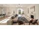 Open floor plan featuring hardwood floors, a fireplace, and a modern chandelier at 906 Fairfield Dr, Marietta, GA 30068