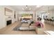 Bright, open living room with hardwood floors, fireplace, and seamless indoor-outdoor flow at 906 Fairfield Dr, Marietta, GA 30068