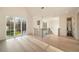 Spacious living room featuring hardwood floors, large windows, and modern lighting fixtures at 906 Fairfield Dr, Marietta, GA 30068