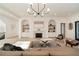 Bright living room features a stone fireplace, built-in shelving, and hardwood floors at 906 Fairfield Dr, Marietta, GA 30068
