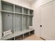 Custom mudroom featuring built-in cubbies and a bench with decorative pillows at 906 Fairfield Dr, Marietta, GA 30068