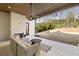 Covered patio featuring an outdoor seating area and backyard access at 906 Fairfield Dr, Marietta, GA 30068