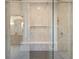 Modern shower with glass door, built-in seat, and elegant tile work at 906 Fairfield Dr, Marietta, GA 30068