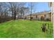 Fenced backyard with green grass and covered patio at 4055 S Bogan Rd, Buford, GA 30519