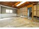 Unfinished basement space with exposed framing and concrete flooring at 4055 S Bogan Rd, Buford, GA 30519