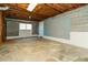 Spacious unfinished basement with exposed ceiling and concrete floor at 4055 S Bogan Rd, Buford, GA 30519