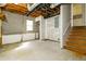 Large basement area with utilities and stairway to upper floor at 4055 S Bogan Rd, Buford, GA 30519