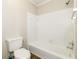 Bright bathroom features a white tiled shower and tub combination at 4055 S Bogan Rd, Buford, GA 30519