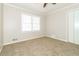 Bedroom features carpet floors, a ceiling fan, and a window with blinds at 4055 S Bogan Rd, Buford, GA 30519