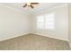Inviting bedroom with carpeted floors, neutral paint, and a large window for natural light at 4055 S Bogan Rd, Buford, GA 30519