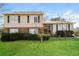 Charming home featuring a well-manicured lawn and inviting front entrance, perfect for a Gathering at 4055 S Bogan Rd, Buford, GA 30519