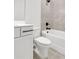This bathroom features modern fixtures and a shower and bathtub combo at 557 Red Clay Farm Ln, Suwanee, GA 30024