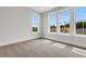Bedroom featuring three bright windows providing lots of natural light at 557 Red Clay Farm Ln, Suwanee, GA 30024