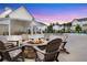 Outdoor common area with fireplace and seating for residents to gather and socialize at 557 Red Clay Farm Ln, Suwanee, GA 30024