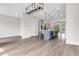 Open living space showcasing hardwood floors, neutral walls, and an elegant kitchen island at 557 Red Clay Farm Ln, Suwanee, GA 30024