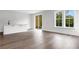 Bright living room with bar top, slider to the backyard, and large windows at 557 Red Clay Farm Ln, Suwanee, GA 30024