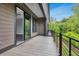 Spacious balcony with black metal railings offers an outdoor area with views of surrounding greenery at 577 Red Clay Farm Ln, Suwanee, GA 30024